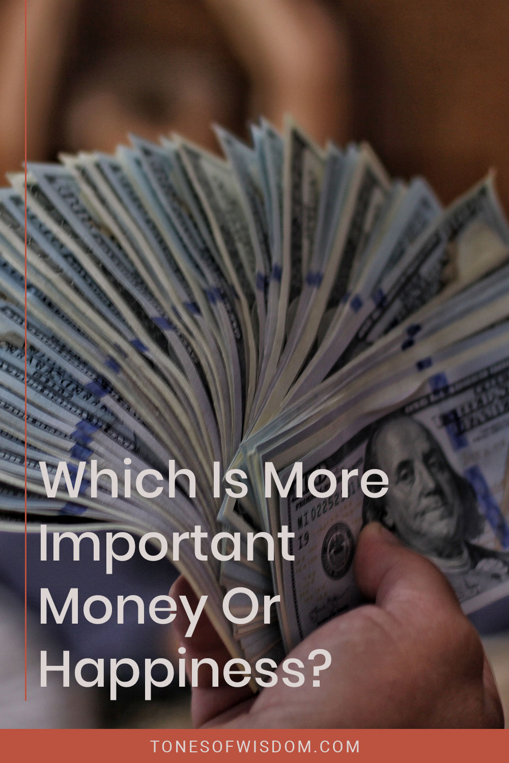 Dollar bills in a hand - Which Is More Important Money Or Happiness?
