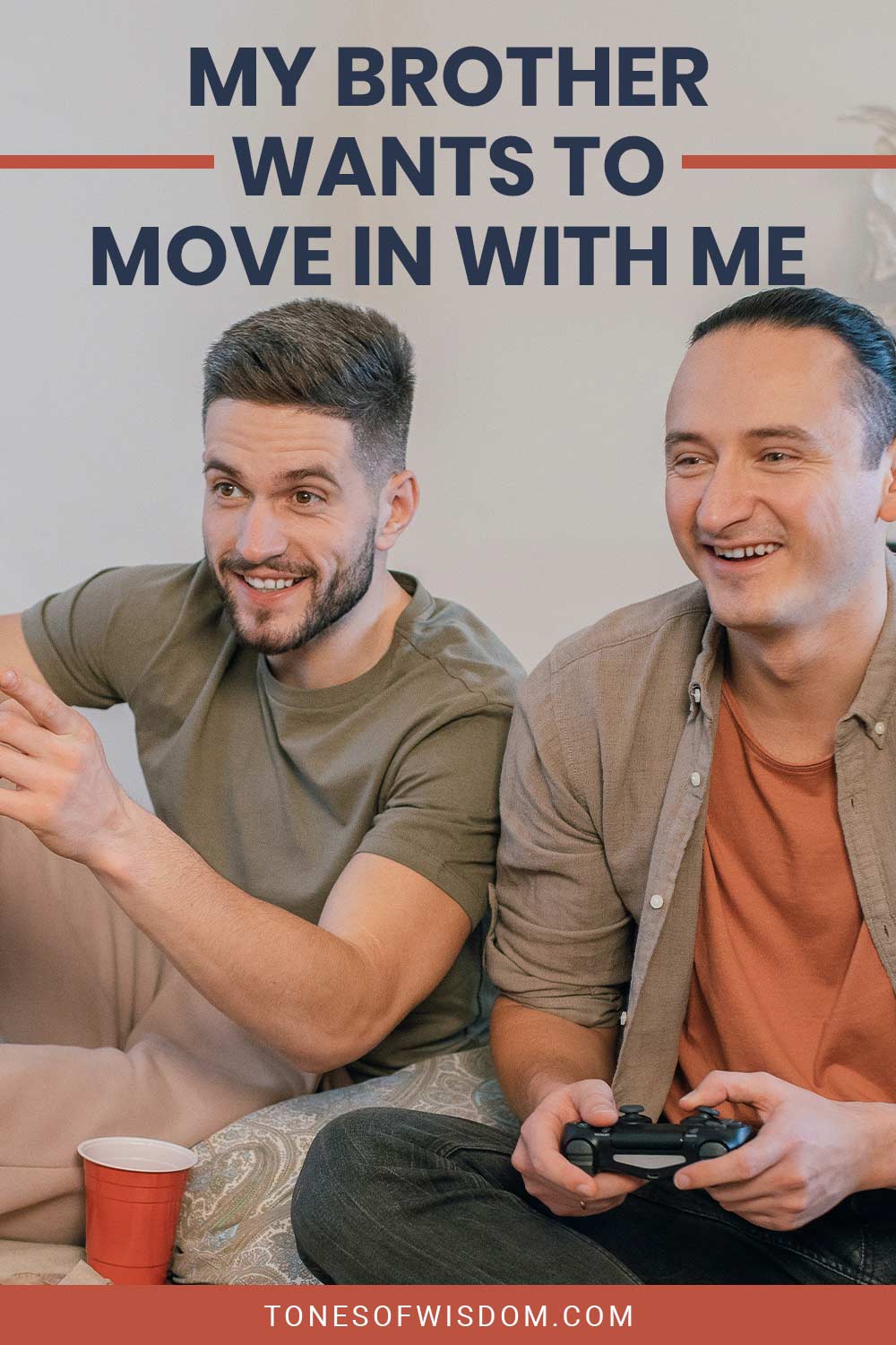 Two men playing games and one of them holding a controller - My Brother Wants to Move in With Me