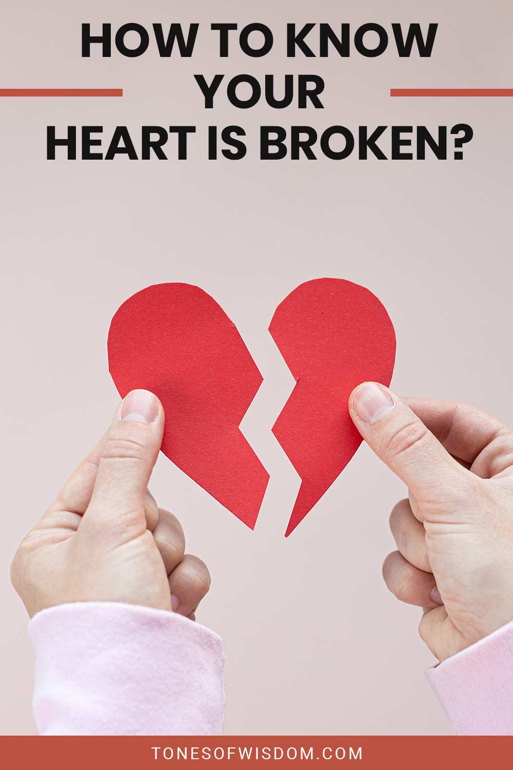 A separate heart shaped paper in a person's hands - How To Know Your Heart Is Broken?