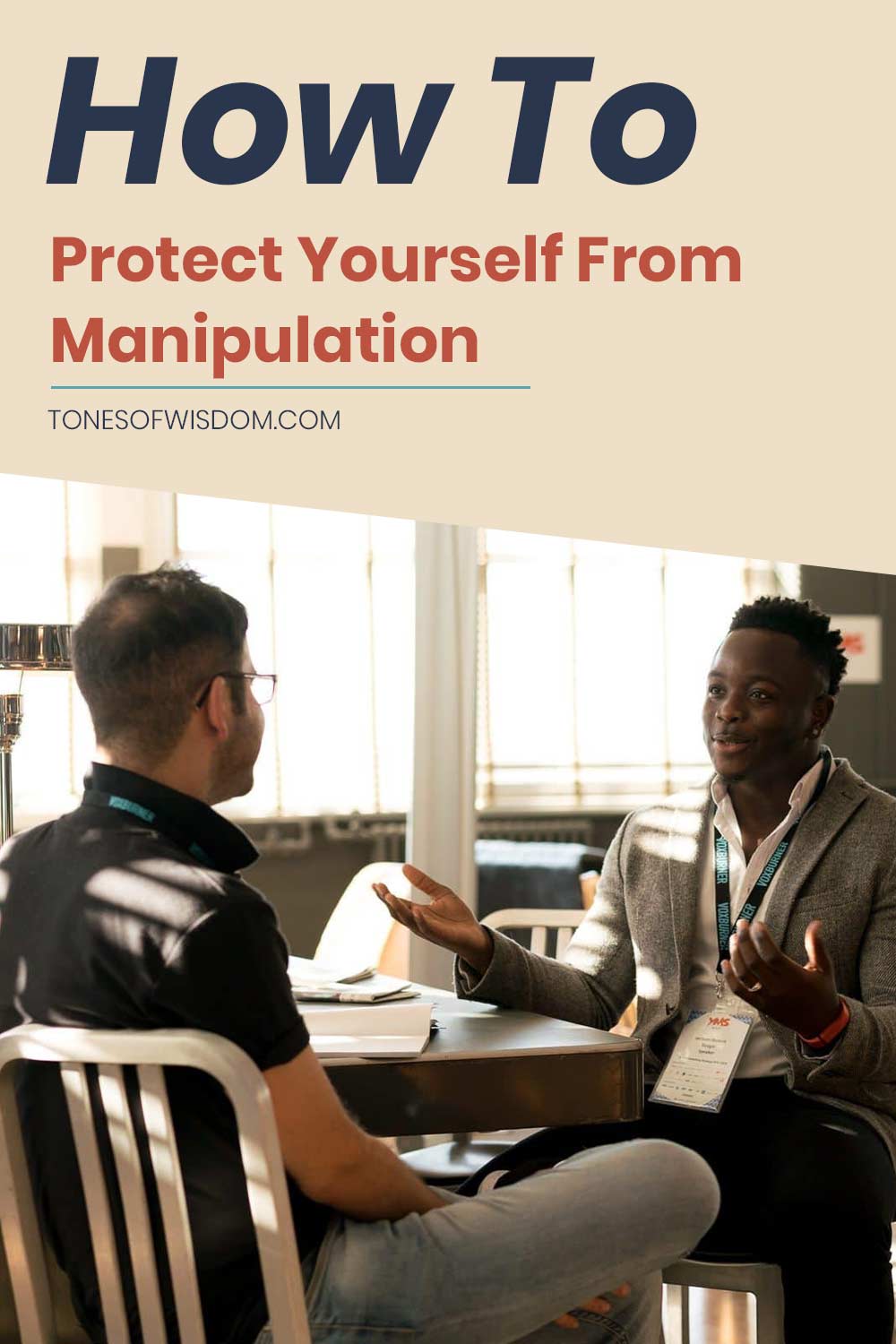 Two men having a discussion sitting in front of a table - How To Protect Yourself From Manipulation?