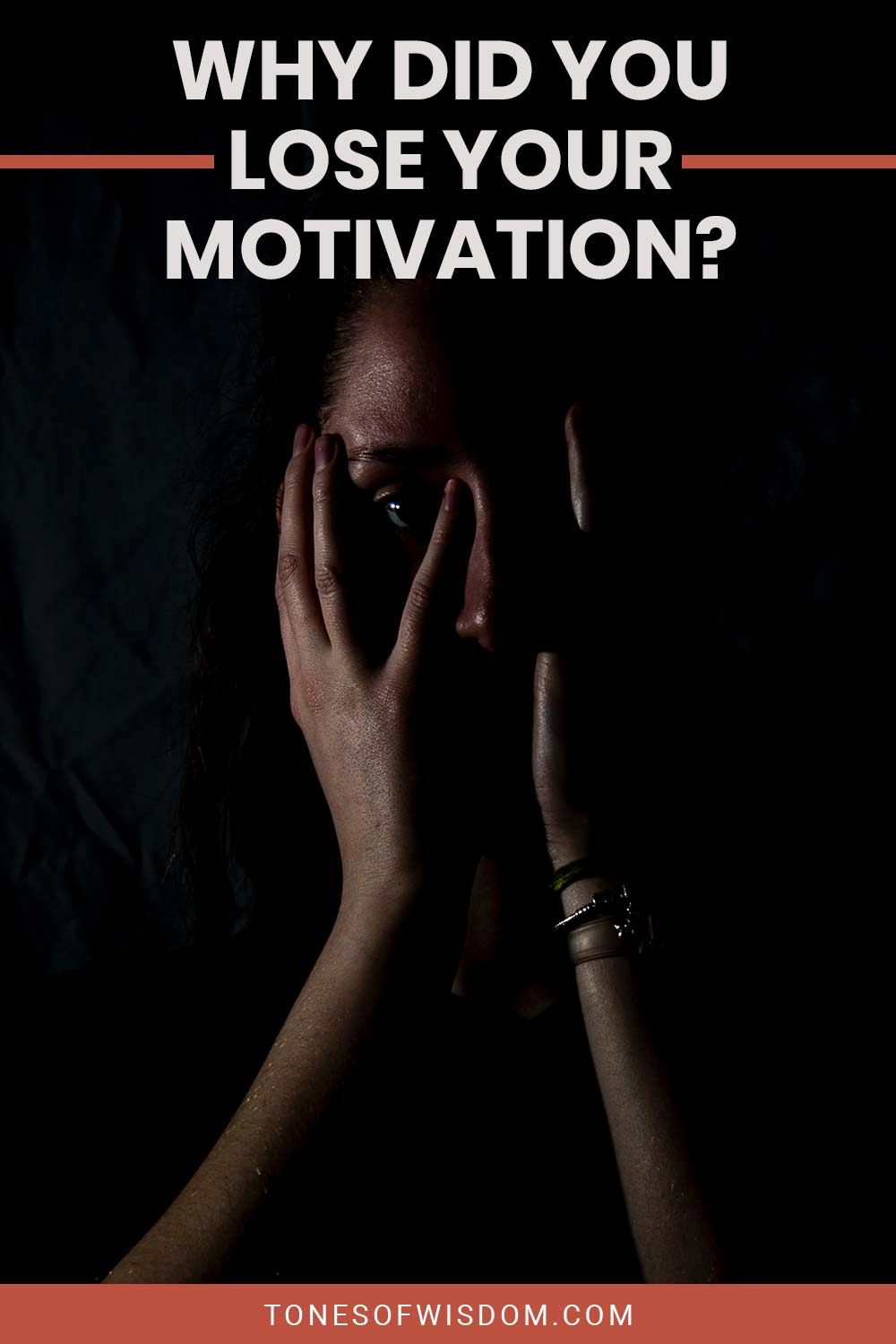 Woman in dark with her hands on her face - Why Did You Lose Your Motivation?