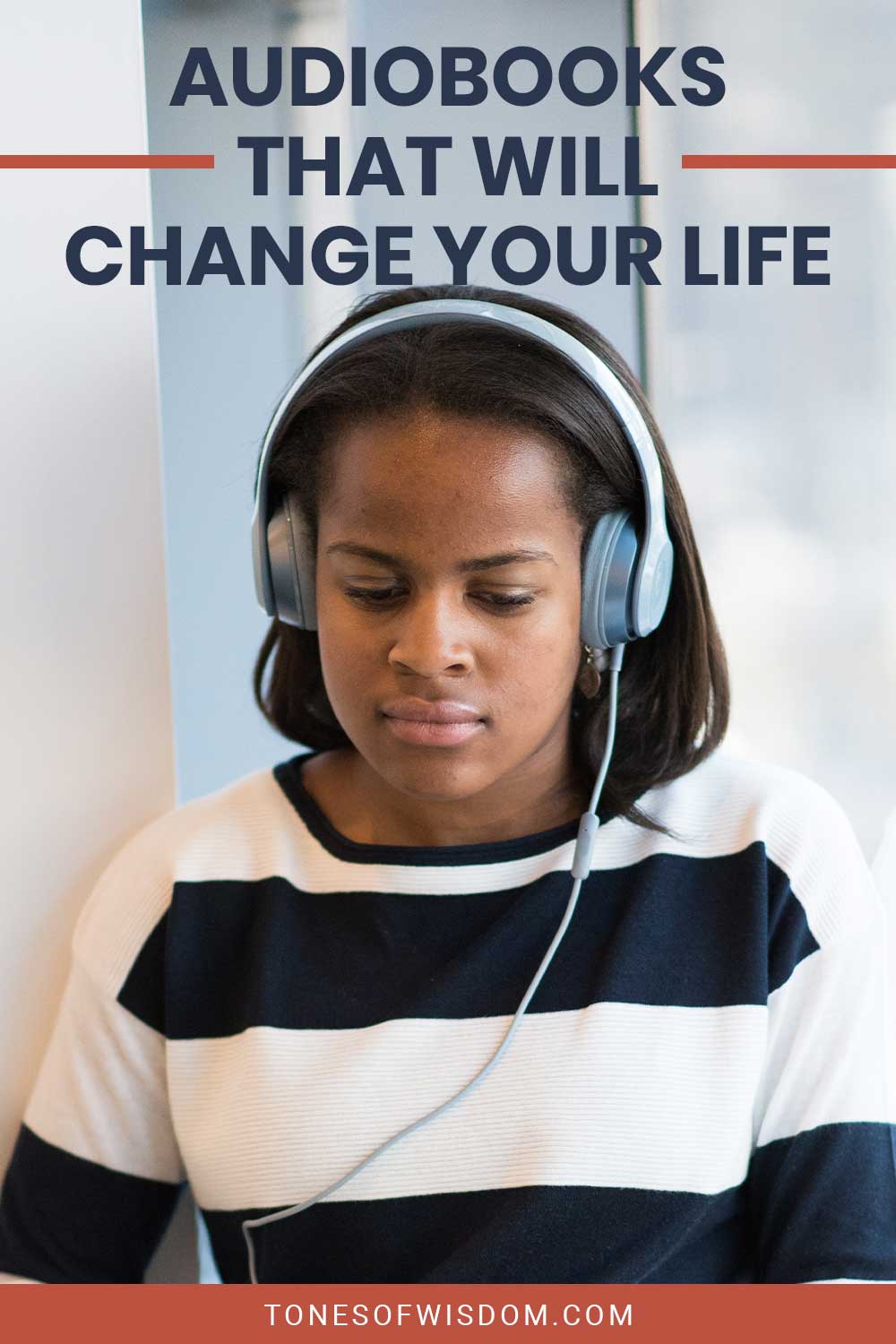 Girl wearing grey headphones - Audiobooks That Will Change Your Life.