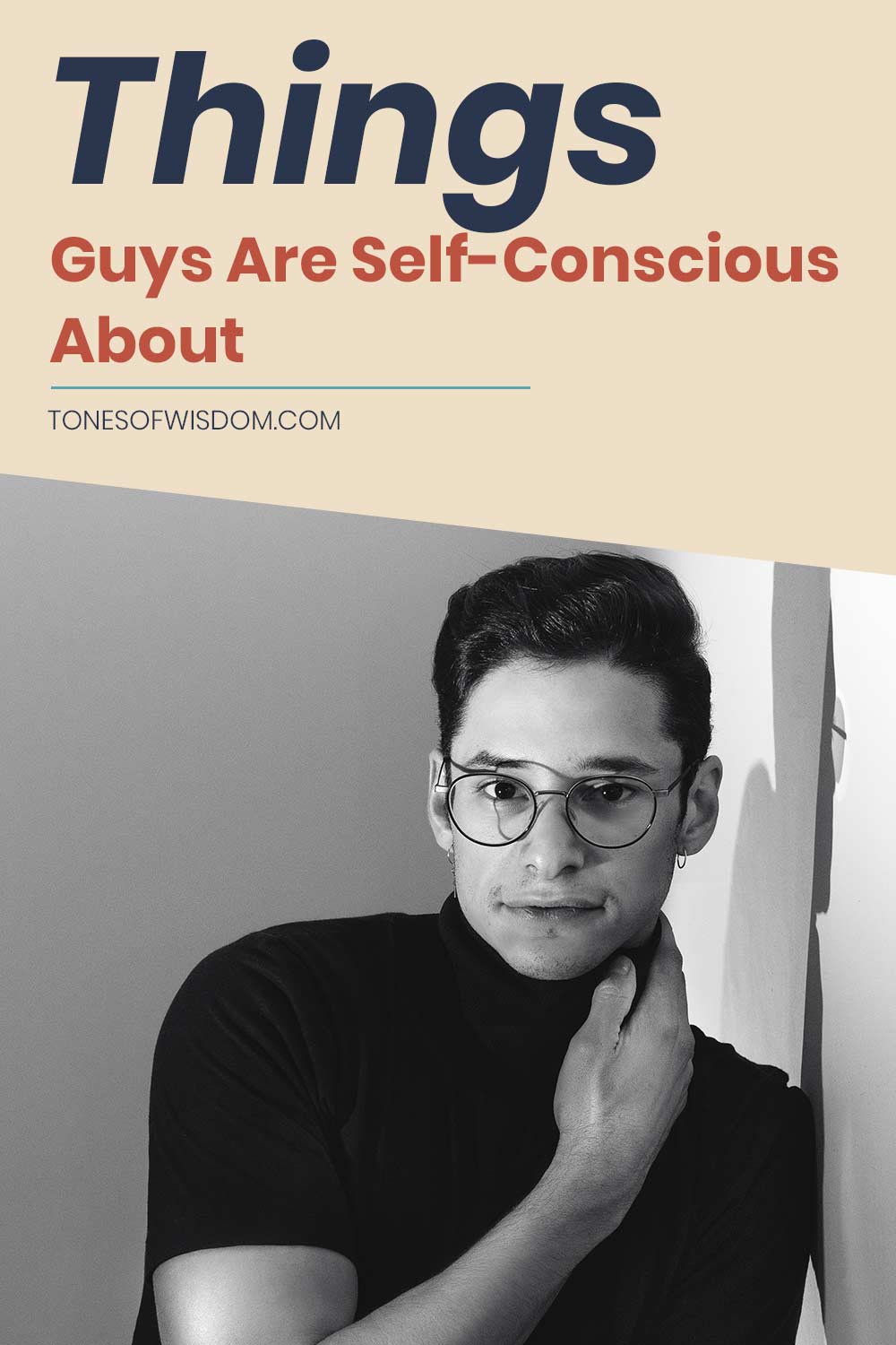 Guy in black t-shirt wearing glasses - Things Guys Are Self-Conscious About.